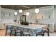 Modern kitchen island featuring a large countertop, stylish seating, and pendant lighting at 11522 Trivio Ter, Palmetto, FL 34221