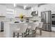 Modern kitchen with stainless steel appliances, white cabinets, and stylish pendant lighting at 11522 Trivio Ter, Palmetto, FL 34221