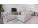 Spacious living room featuring neutral decor, recessed lighting, and open access to the dining area at 11522 Trivio Ter, Palmetto, FL 34221