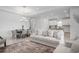 Bright living room featuring stylish furniture, a modern dining area, and a neutral color palette at 11522 Trivio Ter, Palmetto, FL 34221