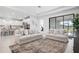 Bright, open-concept living area featuring neutral decor and large sliding glass doors at 11522 Trivio Ter, Palmetto, FL 34221