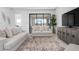 Bright, open-concept living area featuring neutral decor and large sliding glass doors at 11522 Trivio Ter, Palmetto, FL 34221