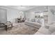 Bright living room featuring stylish furniture, a modern dining area, and a neutral color palette at 11522 Trivio Ter, Palmetto, FL 34221