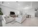 Spacious living room featuring neutral decor, recessed lighting, and open access to the dining area at 11522 Trivio Ter, Palmetto, FL 34221