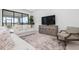 Bright living room featuring neutral decor, large sliding glass doors, and recessed lighting at 11522 Trivio Ter, Palmetto, FL 34221