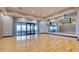 Bright yoga room with wood floors, mirrored walls, and natural light, providing an ideal space for fitness and wellness activities at 11522 Trivio Ter, Palmetto, FL 34221