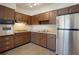 Kitchen featuring stainless steel appliances and ample cabinetry at 124 E 119Th Ave, Tampa, FL 33612