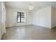 Bright living room with ample natural light, neutral walls, and terrazzo flooring for easy maintenance at 124 E 119Th Ave, Tampa, FL 33612