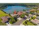 Beautiful lakefront property featuring lush landscaping and a spacious driveway on a desirable neighborhood street at 12420 Aster Ave, Bradenton, FL 34212