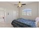 Bedroom featuring a ceiling fan and a sunlit window, adding charm and character to the space at 12420 Aster Ave, Bradenton, FL 34212