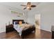 Cozy bedroom with wood floors and a decorative window, creating a relaxing atmosphere at 12420 Aster Ave, Bradenton, FL 34212