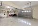 Spacious garage ready for vehicles, projects, and storage, featuring a large garage door and ample ceiling height at 12420 Aster Ave, Bradenton, FL 34212