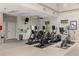 Well-equipped gym space with stationary bikes, ceiling fan, and ample natural light at 12420 Aster Ave, Bradenton, FL 34212