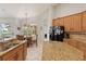 Eat-in kitchen featuring granite counters and stainless appliances with a large window overlooking the pool at 12420 Aster Ave, Bradenton, FL 34212