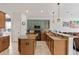 Updated kitchen featuring granite countertops, an island, and modern appliances at 12420 Aster Ave, Bradenton, FL 34212