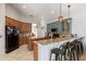 Spacious kitchen with modern appliances, granite countertops, and a breakfast bar for casual dining at 12420 Aster Ave, Bradenton, FL 34212