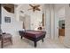 Open living space featuring a pool table and staircase at 12420 Aster Ave, Bradenton, FL 34212