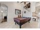 Beautifully tiled living room with a view of the staircase, perfect for relaxation or entertainment at 12420 Aster Ave, Bradenton, FL 34212