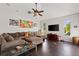 A spacious living room with dark floors, modern decor, and ample seating at 12420 Aster Ave, Bradenton, FL 34212