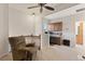Cozy loft featuring a ceiling fan, built-in desk, and comfortable armchair for a relaxed and productive space at 12420 Aster Ave, Bradenton, FL 34212