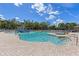 Community pool featuring a water play area, lounge chairs, and well-maintained landscaping on a sunny day at 12420 Aster Ave, Bradenton, FL 34212