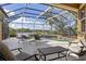 Inviting screened-in pool with a view, comfortable seating, and serene atmosphere at 12420 Aster Ave, Bradenton, FL 34212