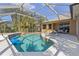 A screened-in pool area with comfortable lounge seating and a well-maintained pool at 12420 Aster Ave, Bradenton, FL 34212