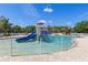 Community pool featuring a water park with slides and shaded seating areas at 12420 Aster Ave, Bradenton, FL 34212