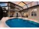 Backyard pool and patio area, ideal for outdoor entertaining and leisure at 13414 Goldfinch Dr, Lakewood Ranch, FL 34202