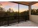 Relaxing covered balcony featuring beautiful views of the trees and sunset at 13414 Goldfinch Dr, Lakewood Ranch, FL 34202