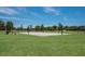 Outdoor basketball court for community members to enjoy games and practice with hoops and green surroundings at 13414 Goldfinch Dr, Lakewood Ranch, FL 34202