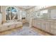 Well-lit bathroom with double vanity, bathtub, and tiled glass shower enclosure at 13414 Goldfinch Dr, Lakewood Ranch, FL 34202