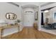 Bright foyer with hardwood floors, a large arched entry, and a view to the study at 13414 Goldfinch Dr, Lakewood Ranch, FL 34202