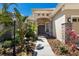 Inviting front entrance with stone accents and tropical foliage creating a warm welcome at 13414 Goldfinch Dr, Lakewood Ranch, FL 34202