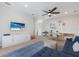 Open concept living room with ample natural light and comfortable furniture and entertainment equipment at 13414 Goldfinch Dr, Lakewood Ranch, FL 34202