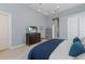 Relaxing main bedroom featuring soft blue walls and a comfortable king-size bed at 13414 Goldfinch Dr, Lakewood Ranch, FL 34202