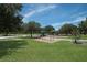 Inviting playground area with swings and play structures set amidst a lush green lawn at 13414 Goldfinch Dr, Lakewood Ranch, FL 34202