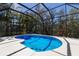Inviting screened-in pool featuring bright blue water and a white concrete surround at 13414 Goldfinch Dr, Lakewood Ranch, FL 34202