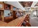 Spacious bar area with multiple TVs and a granite countertop at 13635 Legends Walk Ter, Lakewood Ranch, FL 34202