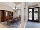 Elegant dining room with chandelier, large windows, and stylish furniture near the entryway at 13635 Legends Walk Ter, Lakewood Ranch, FL 34202