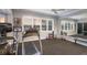 Home gym featuring exercise equipment, natural light, and mirrored wall at 13635 Legends Walk Ter, Lakewood Ranch, FL 34202