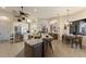 Open kitchen with island, stainless steel appliances, and eat-in dining area at 13635 Legends Walk Ter, Lakewood Ranch, FL 34202