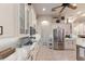 Kitchen area with stainless steel appliances and white cabinets at 13635 Legends Walk Ter, Lakewood Ranch, FL 34202