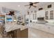 Spacious kitchen with stone countertops, white cabinets, and stainless steel appliances at 13635 Legends Walk Ter, Lakewood Ranch, FL 34202
