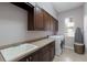 Functional laundry room with ample counter space, cabinetry, and washer/dryer at 13635 Legends Walk Ter, Lakewood Ranch, FL 34202
