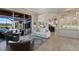 Open concept living room showcasing the kitchen, patio, and pool view at 13635 Legends Walk Ter, Lakewood Ranch, FL 34202