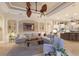 Spacious living room featuring a large sectional couch and unique ceiling fan at 13635 Legends Walk Ter, Lakewood Ranch, FL 34202
