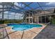 Beautiful screened pool and spa with brick patio at 13635 Legends Walk Ter, Lakewood Ranch, FL 34202
