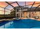 Beautifully landscaped pool area with screened enclosure, offering a perfect oasis for relaxation at 13635 Legends Walk Ter, Lakewood Ranch, FL 34202