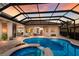 Gorgeous pool and spa area with a screened enclosure, seamlessly blending indoor and outdoor living at 13635 Legends Walk Ter, Lakewood Ranch, FL 34202